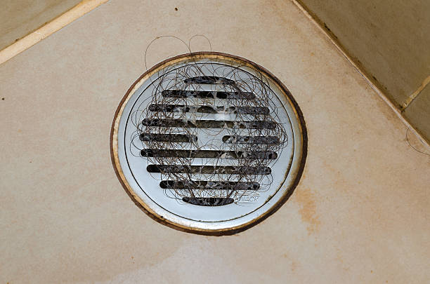 istock Dirty bathroom with hair in the drain 178290764