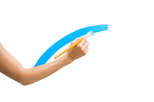 istock woman paints a picture with  brush 178292361