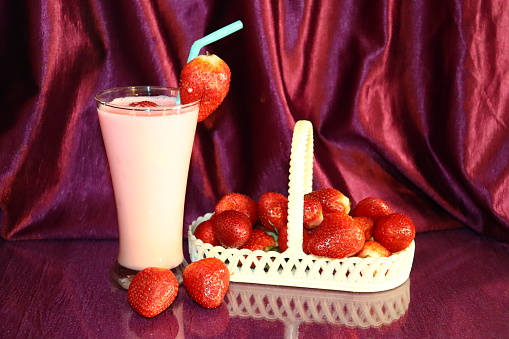 Strawberry Milkshake with floating Strawberry.