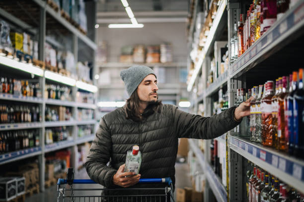 istock Man in a liquor store. 1782964353