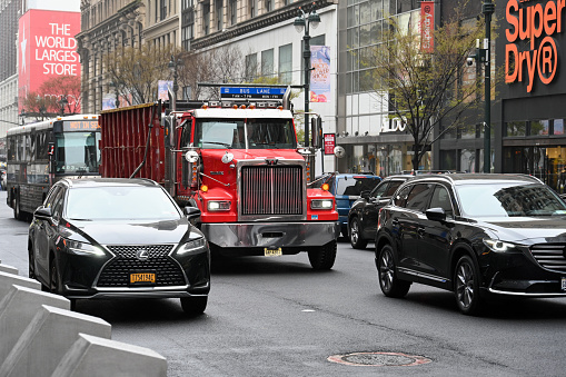 New York, New York, USA, April 5, 2023 - A red Western Star heavy-duty 4900 dump truck on 34th Street downtown Manhattan, New Yorkk City.