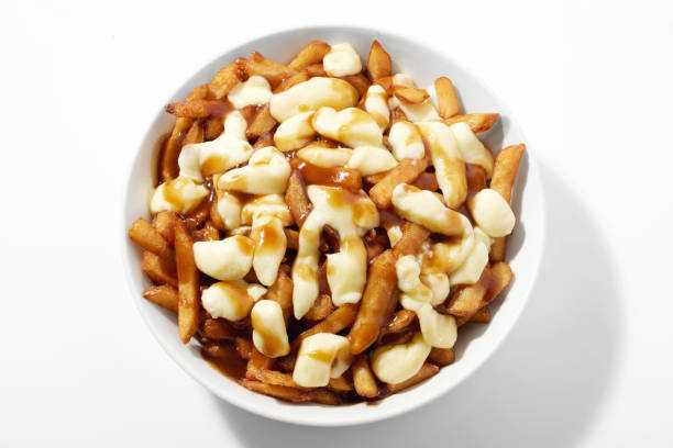 Fries and Gravy Poutine in Bowl on White Background