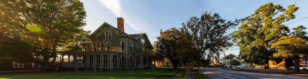 Historic Victorian house with dormers is a state property in Old Raleigh, North Carolina. Stitched panoramic image Local historic landmark of Old Raleigh, NC - Executive mansion, State property. House for government organizations and commissions driveway colonial style house residential structure stock pictures, royalty-free photos & images