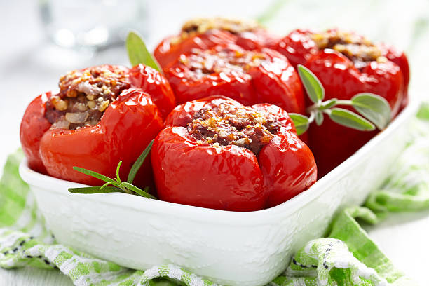 stuffed peppers with meat and bulgur red peppers stuffed with meat and bulgur stuffed pepper stock pictures, royalty-free photos & images