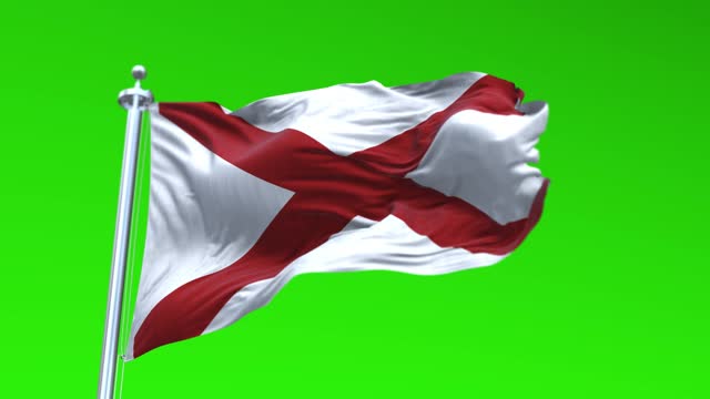 Flag of Alabama US State waving flag animation isolated on a green background Loopable