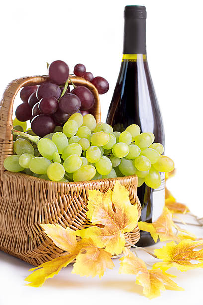 istock Bottle of wine with grapes in basket 178297213