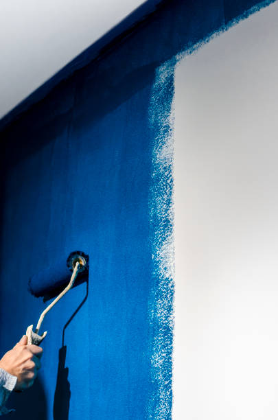 istock Painting a white wall in blue. Repair 1782988307