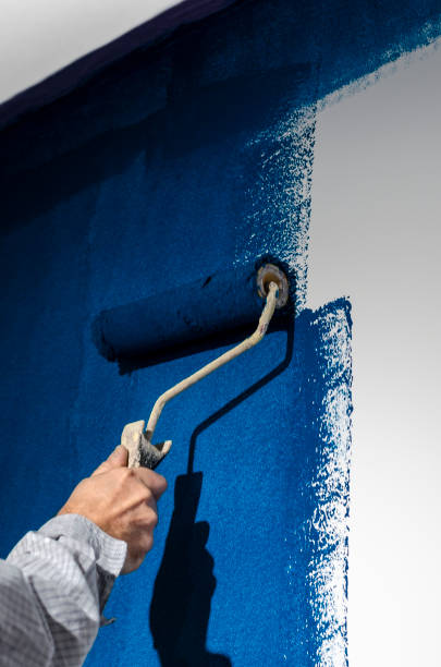 istock Painting a white wall in blue. Repair 1782988311