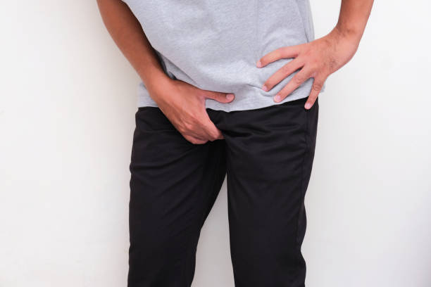 istock A man hand holding his crotch showing in pain expression 1782989247