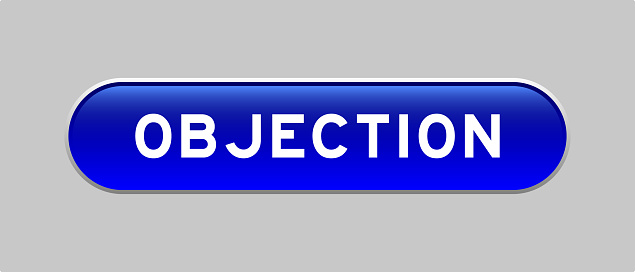 Blue color capsule shape button with word objection on gray background