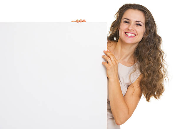 istock Happy young woman showing blank billboard 178300790