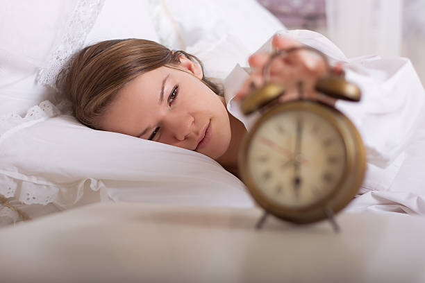 istock girl is sleeping and turns off the alarm 178301704