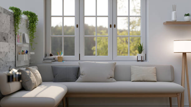 istock A comfortable corner couch against the wall and window and decor in a modern white living room. 1783029300