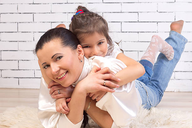 istock daughter is on the back of a mother 178303564