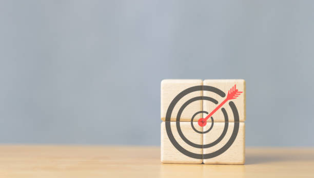 istock Business goals and success. Darts aim icon on wooden cube copy space 1783049784