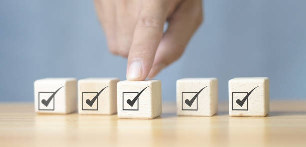istock Corporate Compliance Quality control management, ISO certification, product quality service guarantee. Assessment Enter a wooden cube with a check mark icon. 1783049930