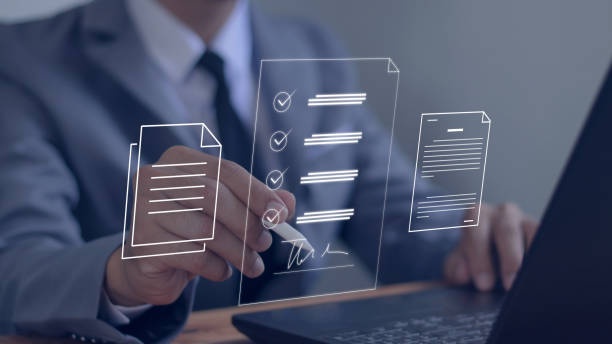 istock Businessman using pen to sign electronic documents with virtual screen on laptop computer on table Electronic signature concept. Technology 1783051360