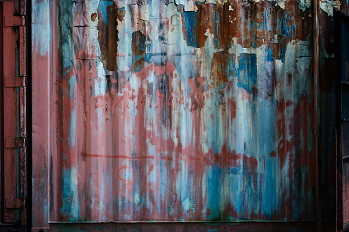Close-up shot of old rusted metal garage door