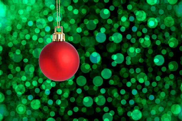 istock Hanging a red Christmas ornament against defocused Christmas lights 1783054666