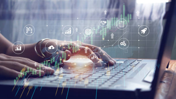 istock business woman using laptop technology concept financial analyst Stock traders analyze business data. Financial graphs on digital tablets and laptop computers. candlestick chart interface 1783061086