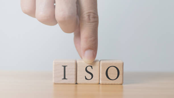istock ISO word on wooden cube quality control concept ISO standard assurance in 1783061624