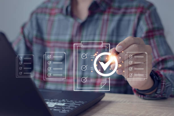 istock Businessman taps check icon on virtual screenValidation concept for business process automation 1783063306