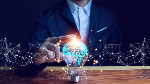 istock Businessman touches a lightbulb with glowing virtual brains and connects to smart thinking, inspiring and innovative networking. 1783064408