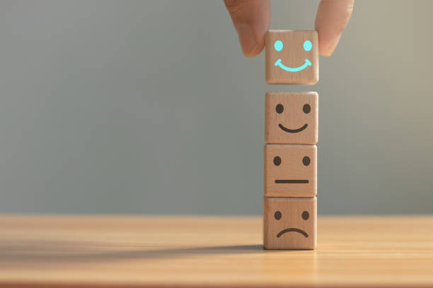 istock Happy smiley face symbol on the table. Rating. Increased score. Customer experience, satisfaction and best service rating concept with copy space. 1783074771