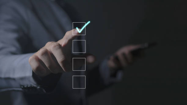 istock businessman check mark in checklist with check mark, online checklist survey, fill out digital form checklist, online survey 1783075301