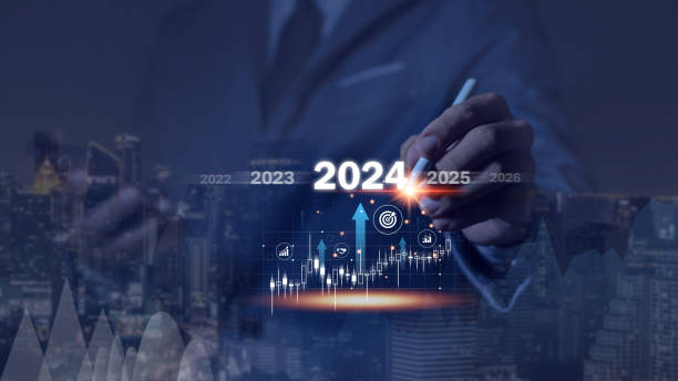 Countdown to 2024 concept. the taps a virtual download bar with a loading progress meter on New Year's Eve, turning the year 2024 to 2025.