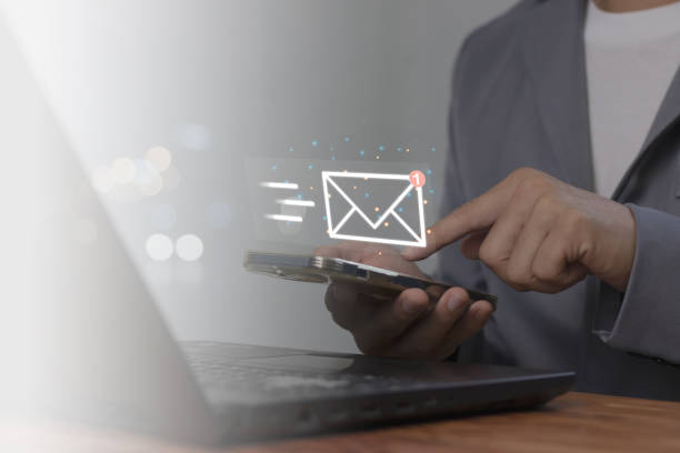 istock Hands using mobile phones and sending online messages with email icons. Email Marketing and Newsletter Ideas 1783082808