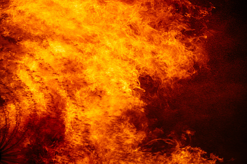 Close-up of fire burning against black background