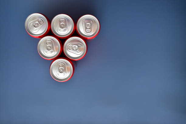 istock close up group of aluminium red cans soft drink put on blue texture background 1783158991
