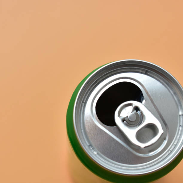 istock aluminum green drink cans on orange background, open cold fresh beverage 1783159530