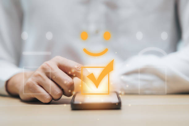 istock Businessman using smartphone for select smiley face icon for client evaluation and customer satisfaction after use product and service concept. 1783203700