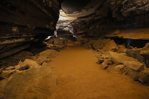 Ruins of a hut build or rocks within the vast dark cavern of Mammoth Cave National Park in Kentucky