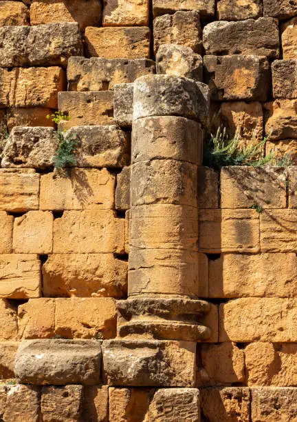 Photo of Detail of the Royal Mausoleum of Mauretania, a funerary monument located on the road between Cherchell and Algiers, in Tipaza, Tipasa Province, Algeria. Column and stone wall.
