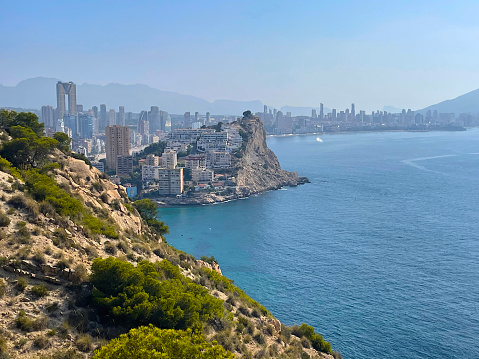 Landscape of Benidorm beach, skyscraper and Finestrat bay from cliff. Summer vacational destination. Travel concept. High quality photo