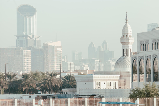 Foggy morning in Abu Dhabi, old and new buildings