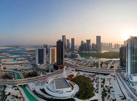 Abu Dhabi, UAE - November 30, 2021: Aerial view on developing part of Al Reem island at golden hour