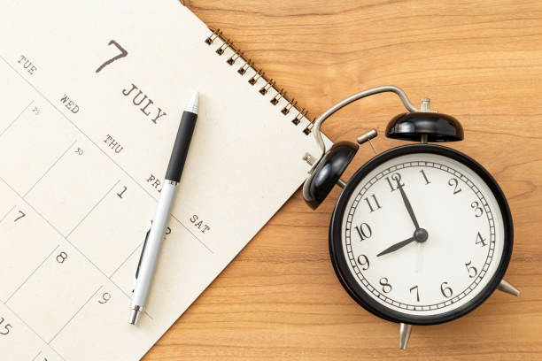 istock A calendar and an alarm clock on the desk. 1783344144