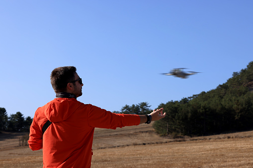Young man using drone