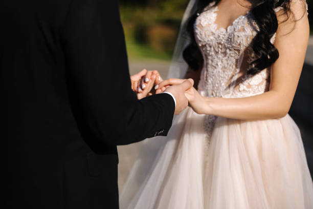 istock Middle celection of groom and bride take each other's hands outdoors. Wedding concept 1783357421
