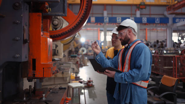 istock Engineer and technician discussing machinery in factory to plan inspection maintenance according to usage cycle, Concepts inspections based on usage cycle maintenance 1783360476