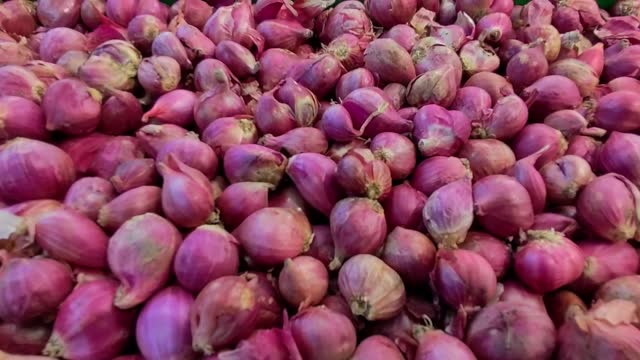 Pile Of Red Onions At Market