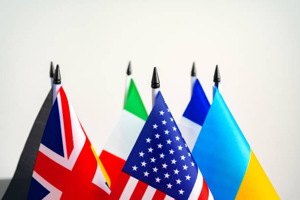 istock Lots of small national flags on table 1783380693