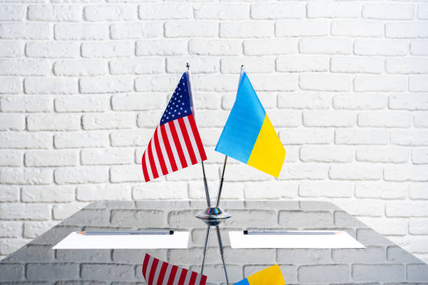 istock USA and Ukraine flags on negotiation table 1783380694