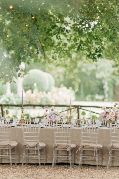 istock Design of wedding table in beige boho style tones with luxurious setting with bouquets of roses, 1783388437