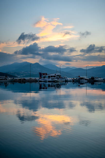 Sunrise sky and cloud reflection on still sea.
