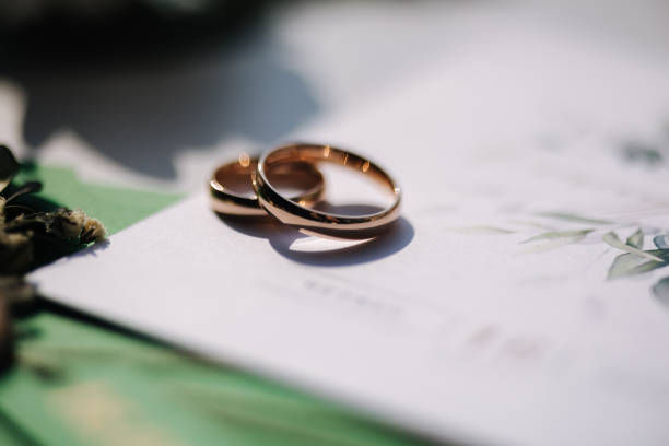 istock Macro photo of wedding rings on oaths 1783409955